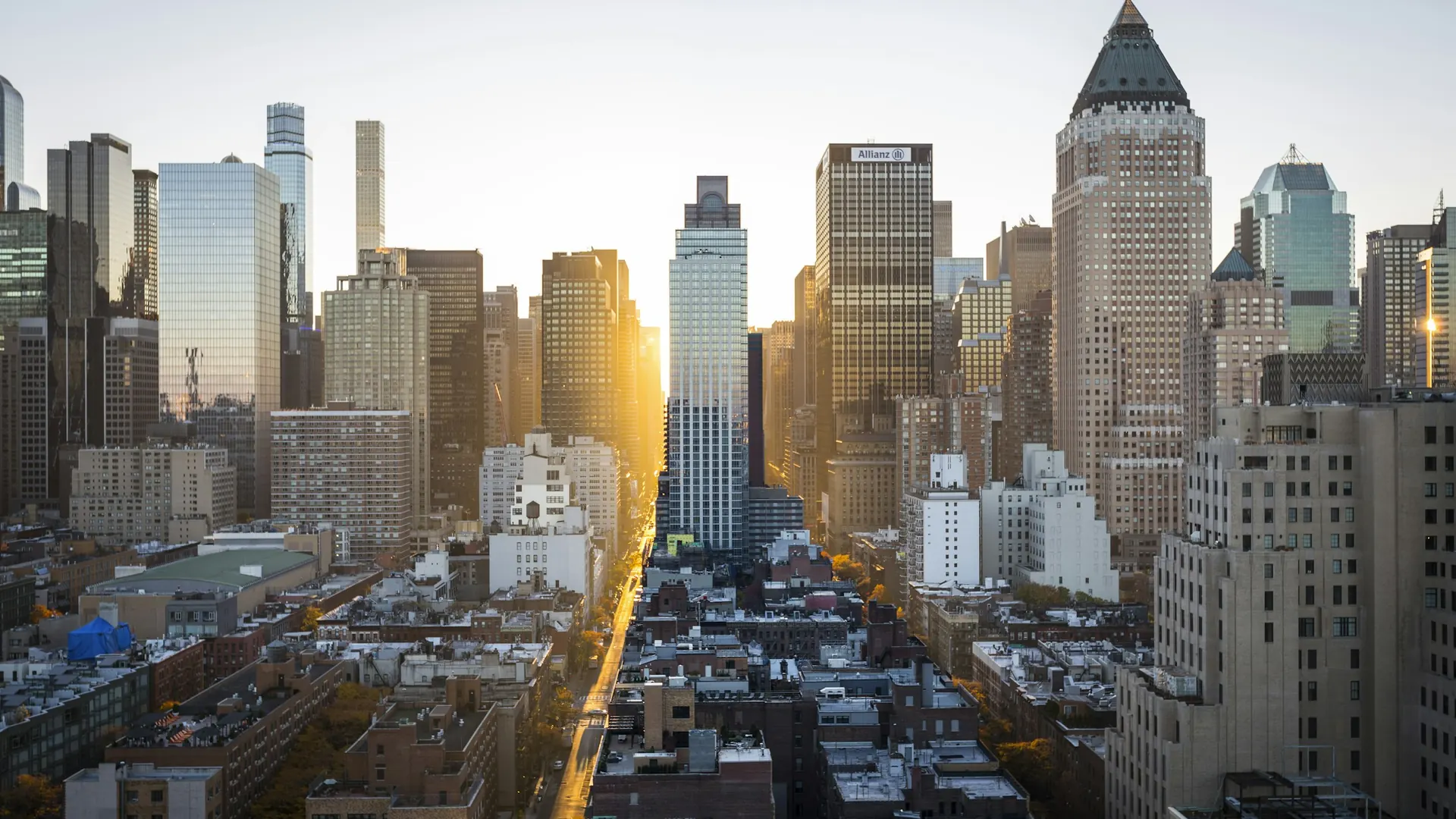 Illuminated city skyline glowing at golden hour